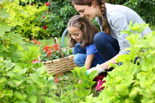 Low-emission van parked while crew separates garden waste for recycling
